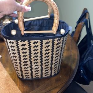 Made in Vietnam bamboo tote. Top handle, inside compartments , fully zippered.